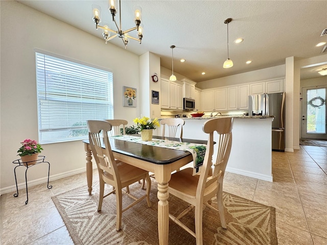 dining room featuring light tile patterned floors, recessed lighting, a textured ceiling, a chandelier, and baseboards