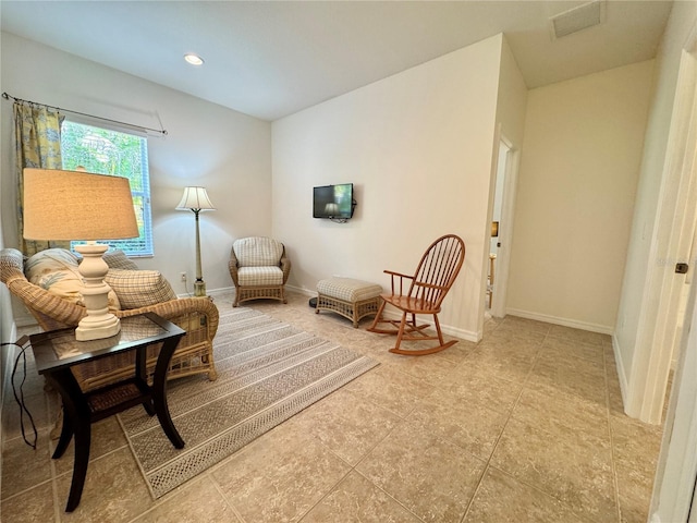 sitting room with recessed lighting, visible vents, and baseboards