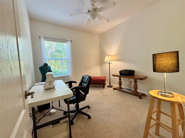 carpeted home office featuring ceiling fan and baseboards