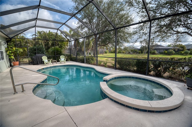 view of swimming pool featuring a lanai, a pool with connected hot tub, and a patio