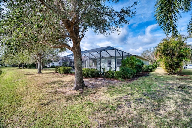 view of yard featuring a lanai