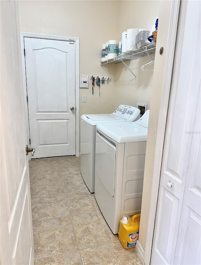 clothes washing area with laundry area and washing machine and dryer