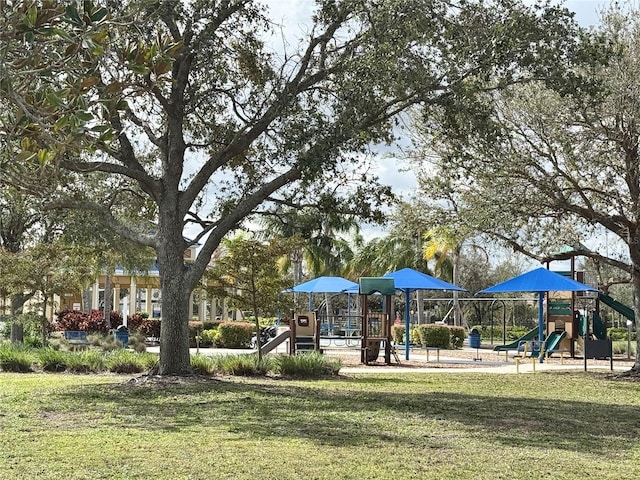 community jungle gym with a lawn