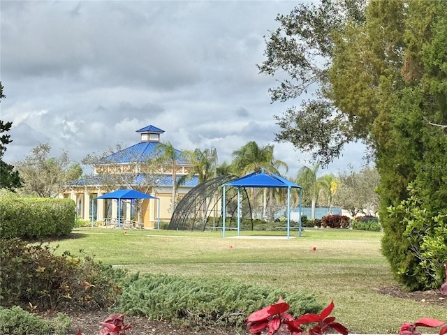 view of playground featuring a yard and a gazebo