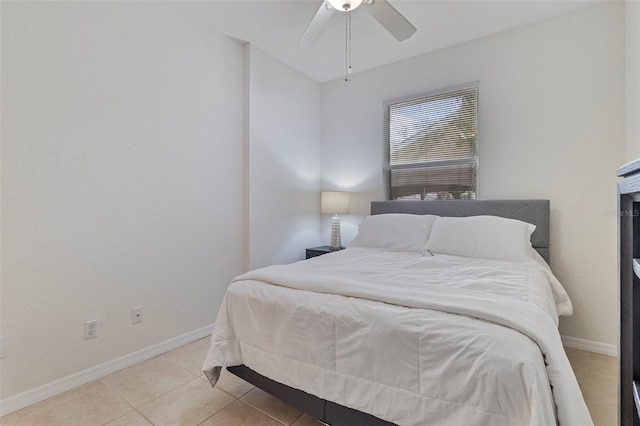 bedroom with baseboards, a ceiling fan, and tile patterned floors