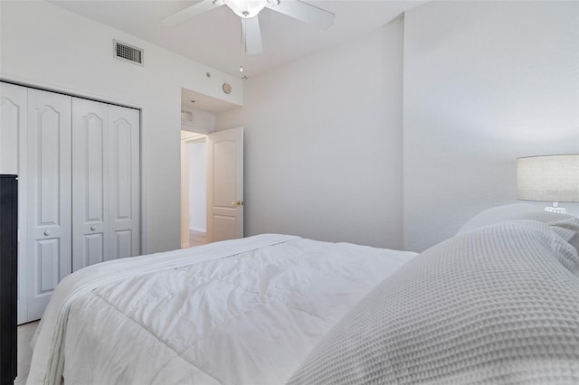 bedroom featuring a ceiling fan, a closet, and visible vents