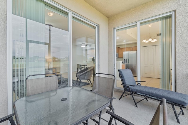 balcony featuring visible vents and outdoor dining area