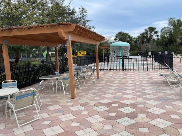 view of patio / terrace featuring fence and a pergola