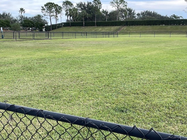 view of yard featuring a rural view and fence