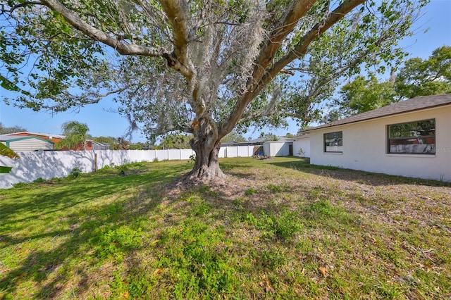 view of yard with a fenced backyard