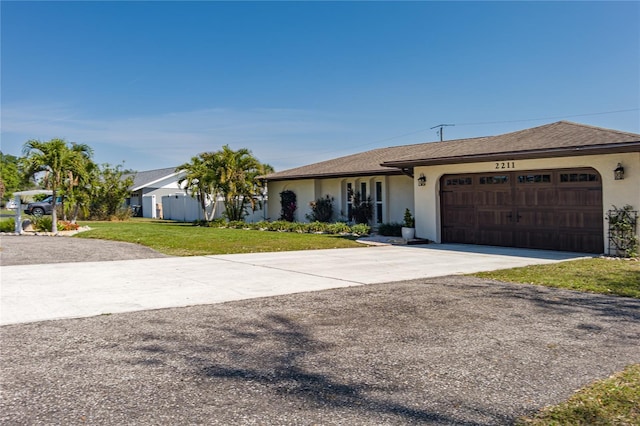 ranch-style house featuring an attached garage, a shingled roof, driveway, stucco siding, and a front lawn