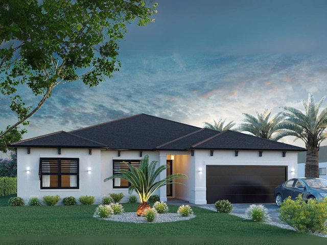 view of front of property with driveway, a lawn, roof with shingles, an attached garage, and stucco siding