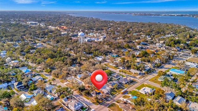 birds eye view of property with a water view and a residential view