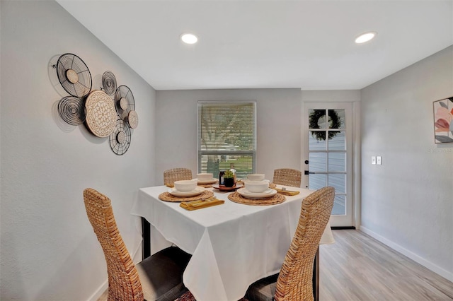 dining area with recessed lighting, baseboards, and light wood finished floors