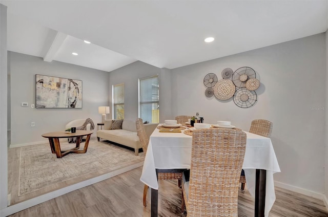 dining area with light wood-style floors, baseboards, and recessed lighting