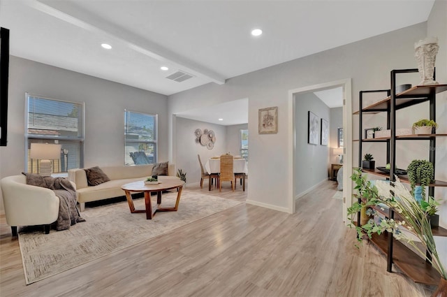 living room featuring light wood finished floors, baseboards, visible vents, beam ceiling, and recessed lighting