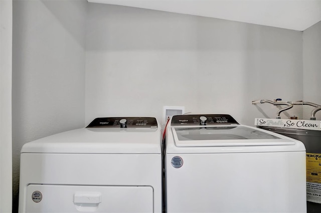 washroom with laundry area and separate washer and dryer