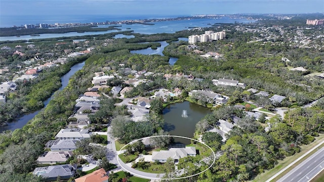 aerial view with a water view and a residential view