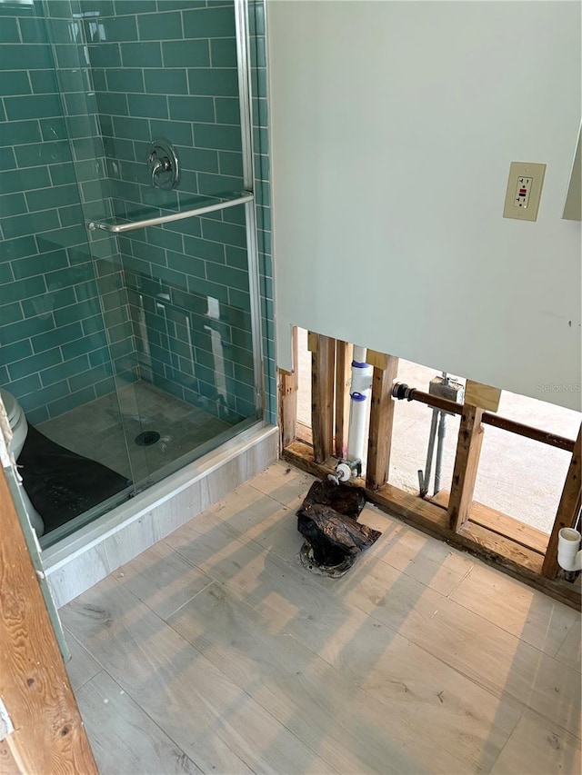 full bath featuring a shower stall