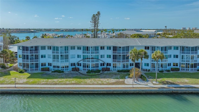 birds eye view of property with a water view