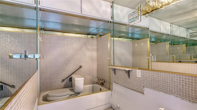 full bathroom featuring tile walls and toilet