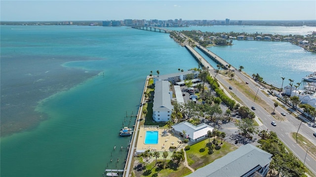 bird's eye view featuring a water view and a city view