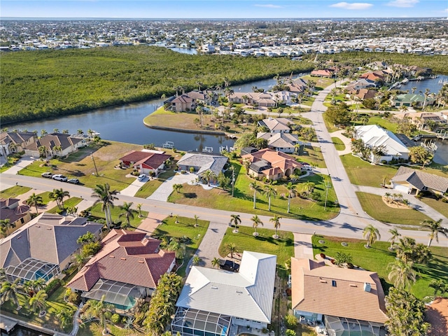 aerial view with a water view and a residential view