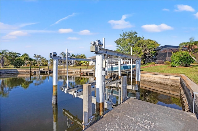 dock area featuring a water view and boat lift