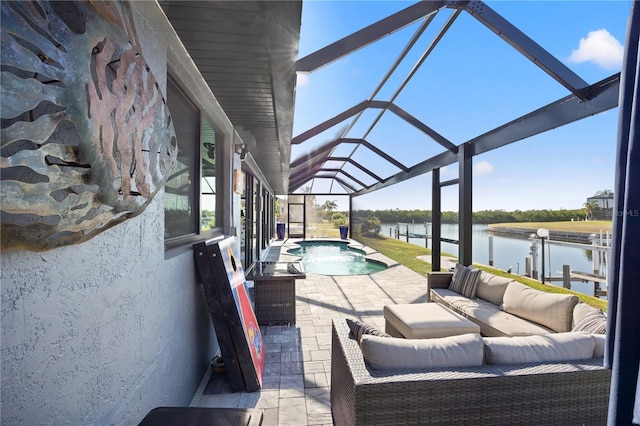 view of patio featuring a lanai, a water view, an outdoor pool, and an outdoor living space