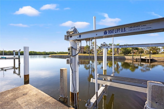 view of dock featuring a water view and boat lift