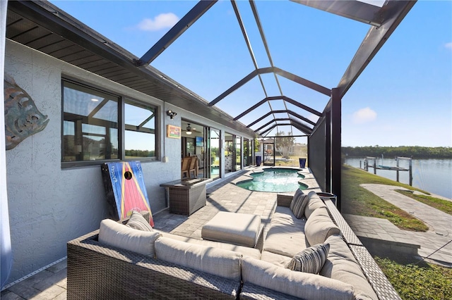 exterior space with a lanai, a water view, a patio, and outdoor lounge area