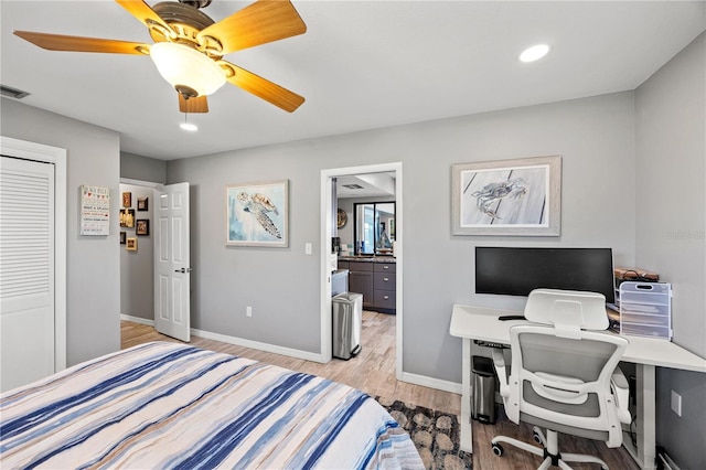 bedroom with ceiling fan, recessed lighting, light wood-style flooring, and baseboards