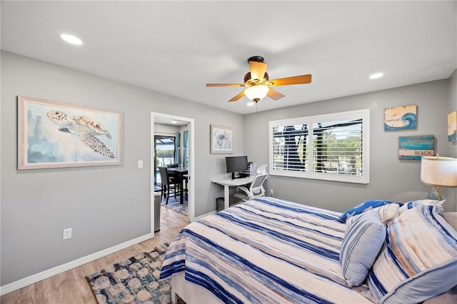 bedroom with light wood-type flooring, baseboards, a ceiling fan, and recessed lighting