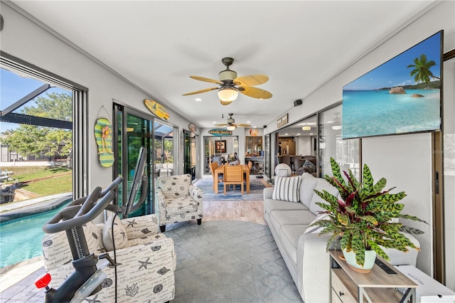 sunroom / solarium with ceiling fan