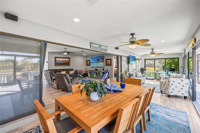 dining space featuring light wood-type flooring, visible vents, and recessed lighting