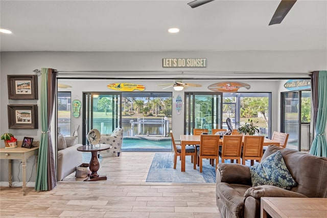 interior space with light wood-style floors, ceiling fan, and recessed lighting