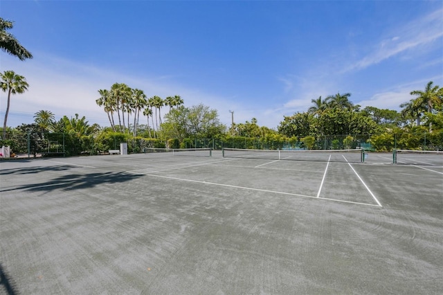 view of sport court featuring fence