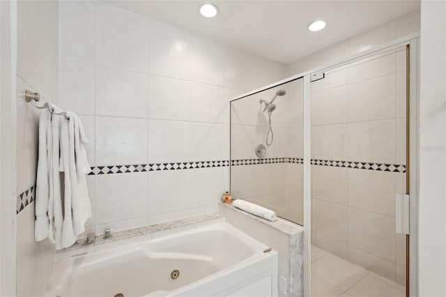 full bath with recessed lighting, a jetted tub, and a shower stall