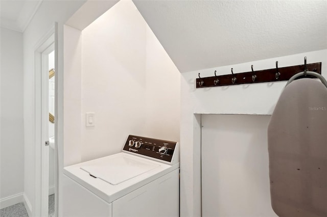 laundry area featuring washer / clothes dryer, a textured ceiling, and laundry area