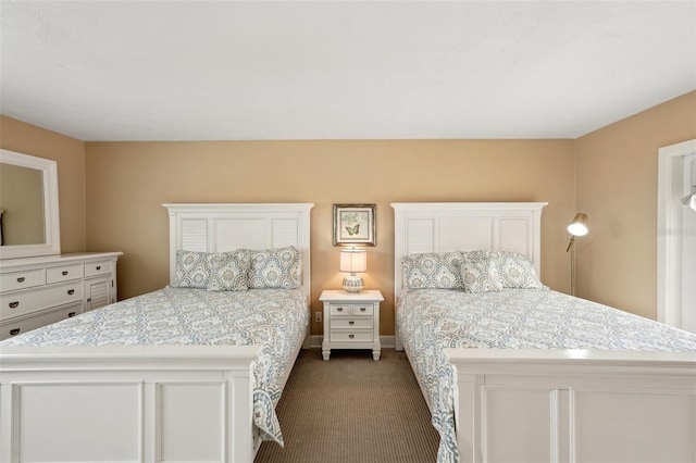 carpeted bedroom with baseboards