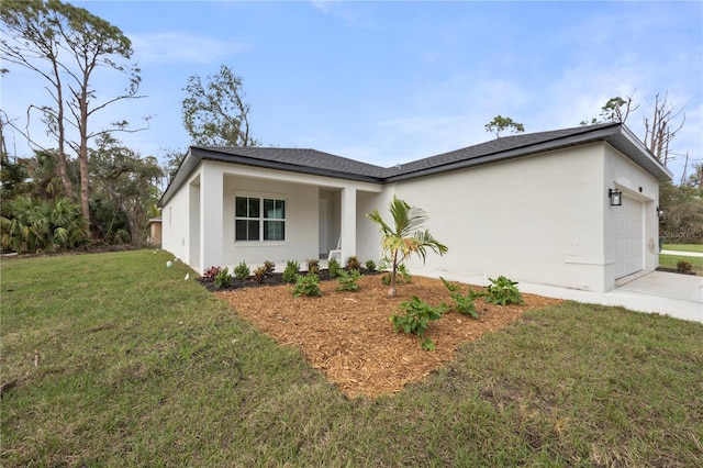 view of front facade featuring a garage, concrete driveway, a front lawn, and stucco siding