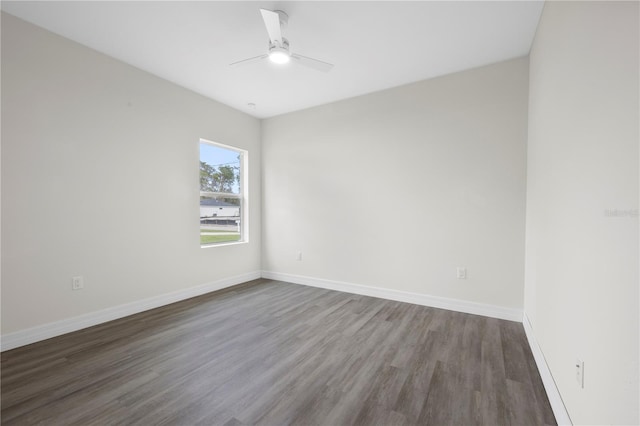 unfurnished room featuring wood finished floors, a ceiling fan, and baseboards