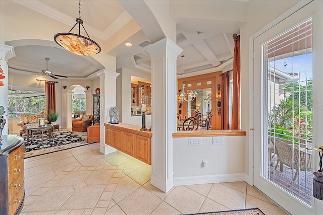 interior space featuring light tile patterned flooring, coffered ceiling, decorative columns, a ceiling fan, and decorative light fixtures