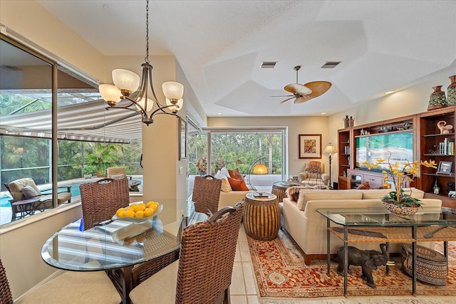 interior space with light tile patterned flooring, visible vents, recessed lighting, and ceiling fan with notable chandelier