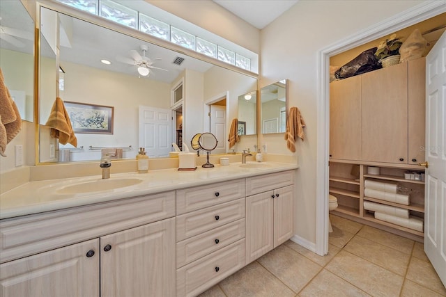 bathroom with double vanity, tile patterned flooring, a sink, and visible vents