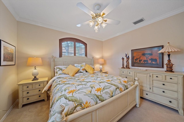 bedroom featuring light carpet, ceiling fan, visible vents, and crown molding