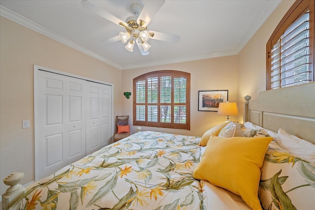 bedroom featuring a closet, multiple windows, crown molding, and ceiling fan