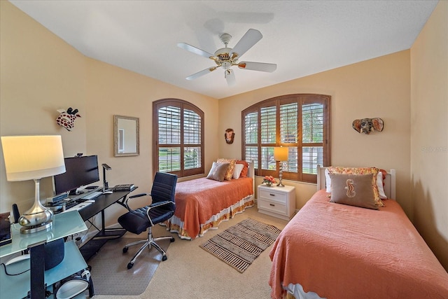 bedroom with light carpet and ceiling fan