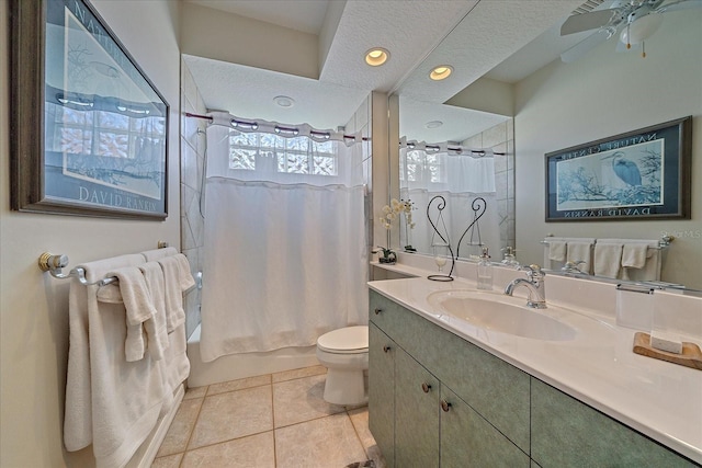 full bathroom featuring a textured ceiling, tile patterned flooring, toilet, vanity, and shower / bath combo