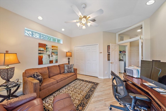 office area with light wood finished floors, recessed lighting, washer / clothes dryer, a ceiling fan, and baseboards